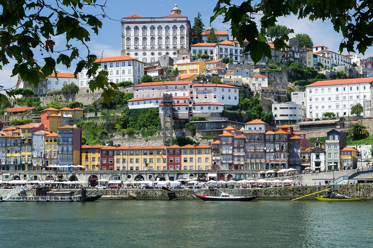 View of Porto city with its traditional architecture, including riverside buildings and iconic bridges.